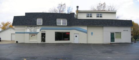 street view of store front and repair garage